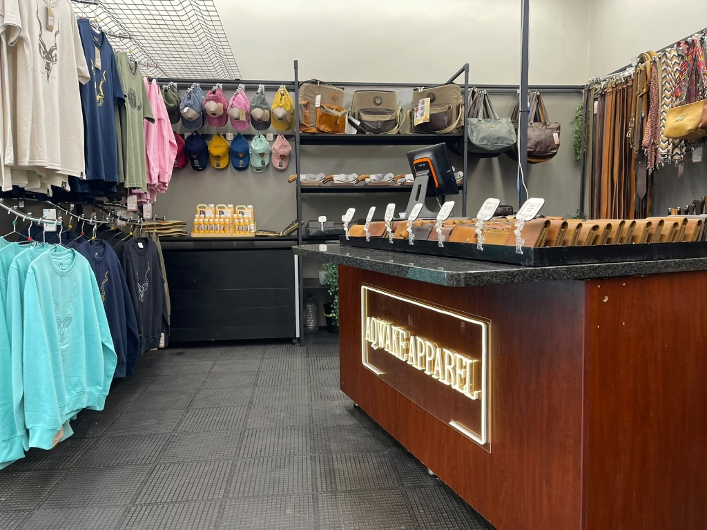 Aqwake Apparel Kiosk Counter with Handcrafted Leather Wallets & Apparel